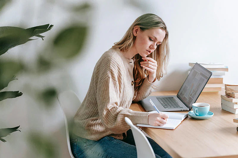 Woman on the computer - Model for Hormone Imbalance Checklist by Ladywell